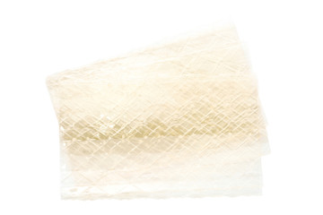 sheet of gelatin leaves on white - obrazy, fototapety, plakaty