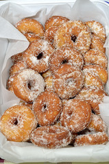 small donuts covered with sugar granules
