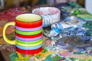 Colorful mug on easel in the Studio