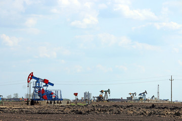 Fototapeta na wymiar pump jack on oilfield mining industry
