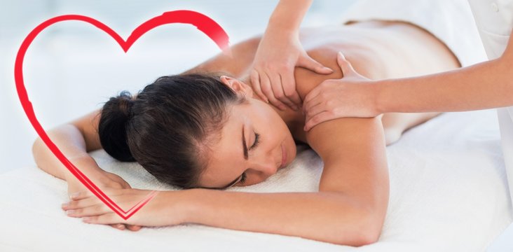 Composite image of a woman receiving a back massage