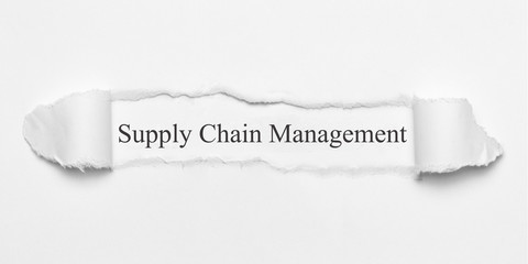 Supply Chain Managemen on white torn paper