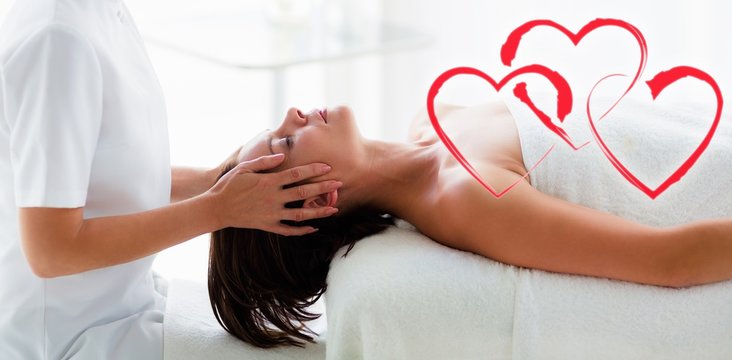 Composite image of head massage with love hearts