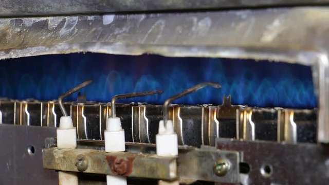 Ignition gas furnace closeup. Blue flame 1