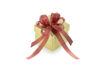 Gold gift box with red ribbon