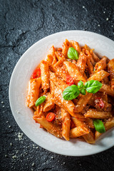 Spicy pasta bolognese with parmesan and basil