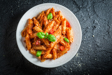 Hot pasta bolognese with parmesan and basil