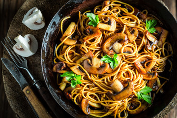 Fresh pasta with mushrooms mushrooms and parsley