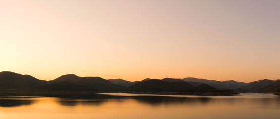 landscape view - sky,mountain and dam in evening time
