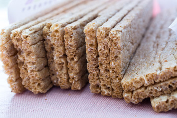 Grain crisp bread and crumbs closeup.