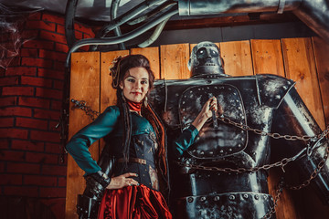 A beautiful woman with the tied male robot.