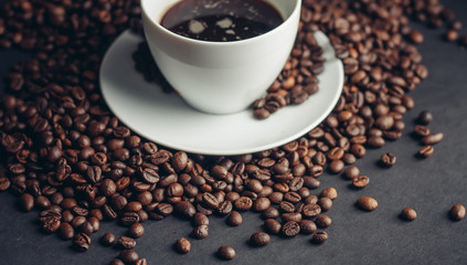 coffee beans, black background, cup, saucer