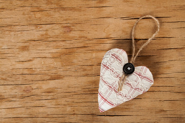 Heart made of cloth on wood desk
