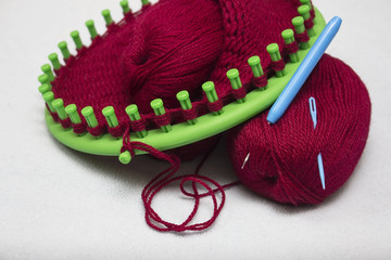 Knitted woolen cap on a circular machine, homemade crafts