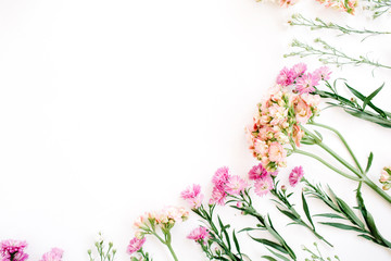 Colorful wildflowers on white background. Flat lay, top view. Valentine's background