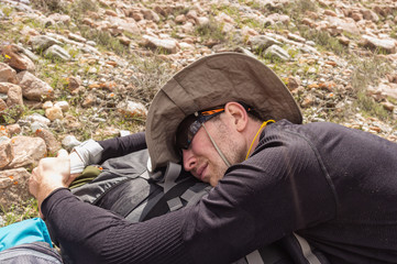 climber tourist tired and lay down to sleep, lay down on the bac