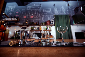Clean glasses for cocktails, vodka, whiskey on the bar  bartender.