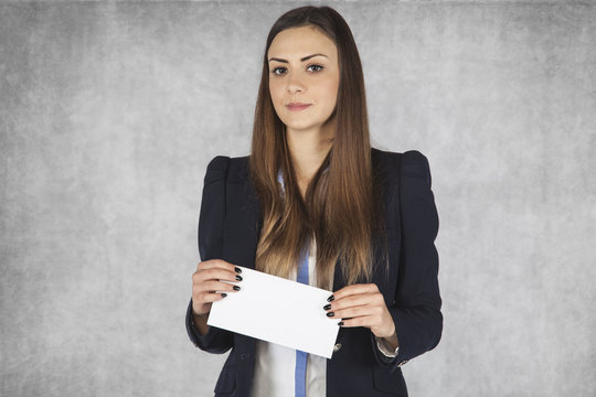 Business Woman Holds In His Hands An Envelope