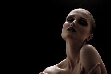 happy luxury woman model with professional makeup on black background