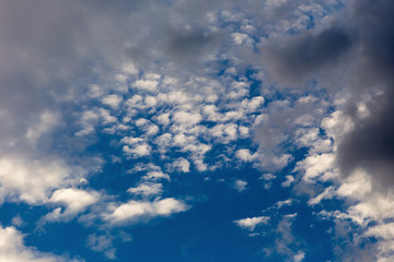 Color of dramatic sky with stormy sunset clouds.