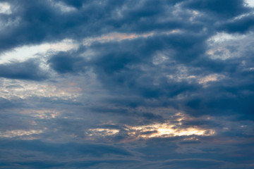 Color of dramatic sky with stormy sunset clouds.