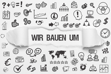 Wir bauen um / weißes Papier mit Symbole