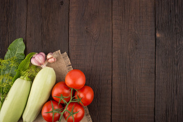 Ripe vegetables on an old wooden table.