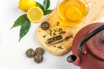 Tea with lemon and leaves in a rustic style