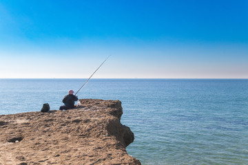 Fototapeta na wymiar Old person fishing