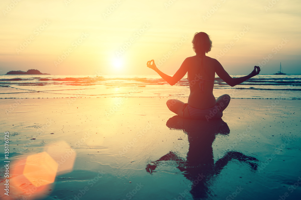 Canvas Prints Yoga silhouette. Meditation girl on the sea during sunset. Fitness and healthy lifestyle.