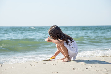 Happy little girl on the beach