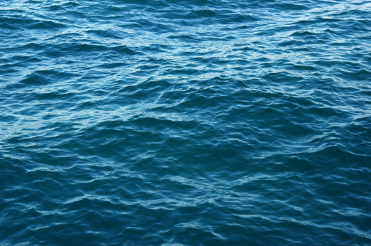 Blue sea water background © Alekss