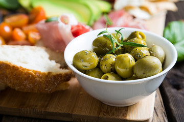 Green olives with spices, natural snacks