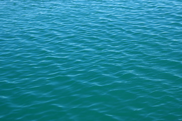 Blue sea surface with waves
