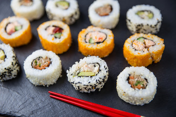 Sushi rolls with chopsticks