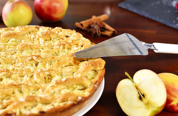 Delicious apple pie or apple cake with fresh apples and spices. Cake arrangement.