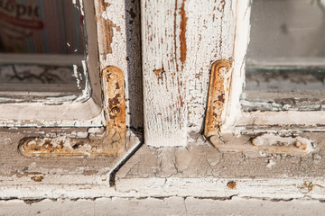 wooden retro old window close-up with a shabby paint texture