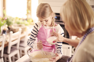 Great little baker working in the kitchen