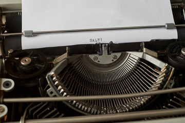 Sale typed words on Vintage Typewriter
