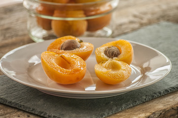 sliced apricots isolated on black background