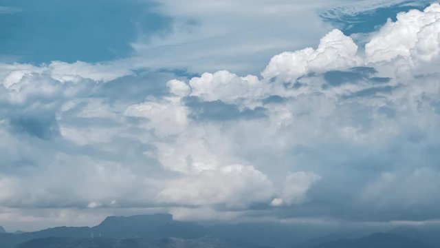 Timelapse of cumulus clouds rolling over mountains of the island of Bali, Indonesia