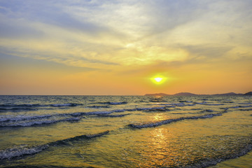 Fototapeta na wymiar Beautiful view of The sun set at the beach with fantasy sky.