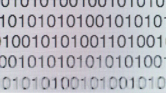 Timelapse of Binary code on a computer screen data code text script
