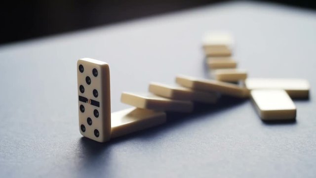 Stopping the domino effect concept for business solution, strategy and successful intervention