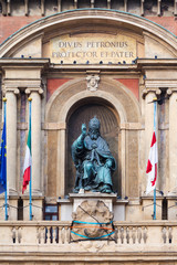 figure on facade of palazzo in Bologna city
