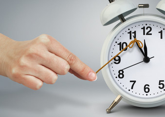 Hand stop alarm clock, time management concept