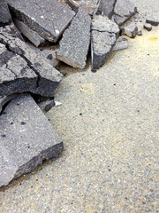 Cracked asphalt pieces background - concept image