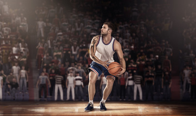 basketball player on parquet with ball in light rays