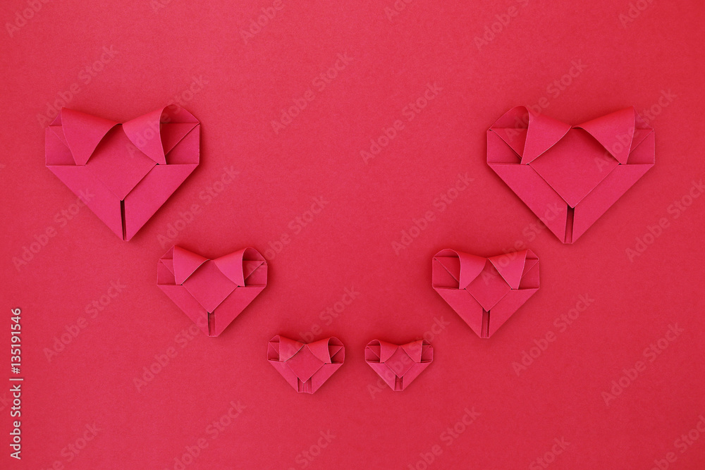 Poster six folding red paper hearts on red for valentine pattern and ba