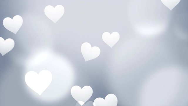 Grey, subtle Valentines video background with floating white hearts can be used for placement of copy or as a design element.